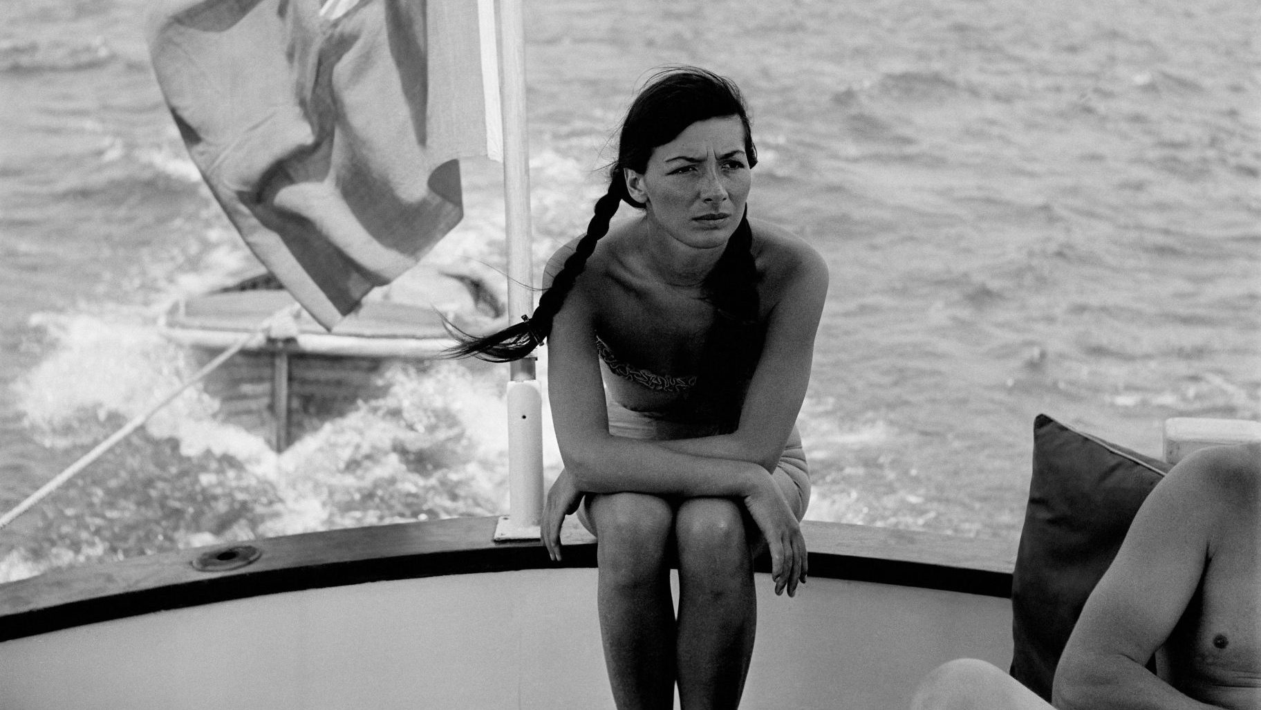 Juliette Gréco, seated in the stern of a boat off the coast of France, in 1950. Credit: REPORTERS ASSOCIES/Gamma- Rapho via Getty Images)