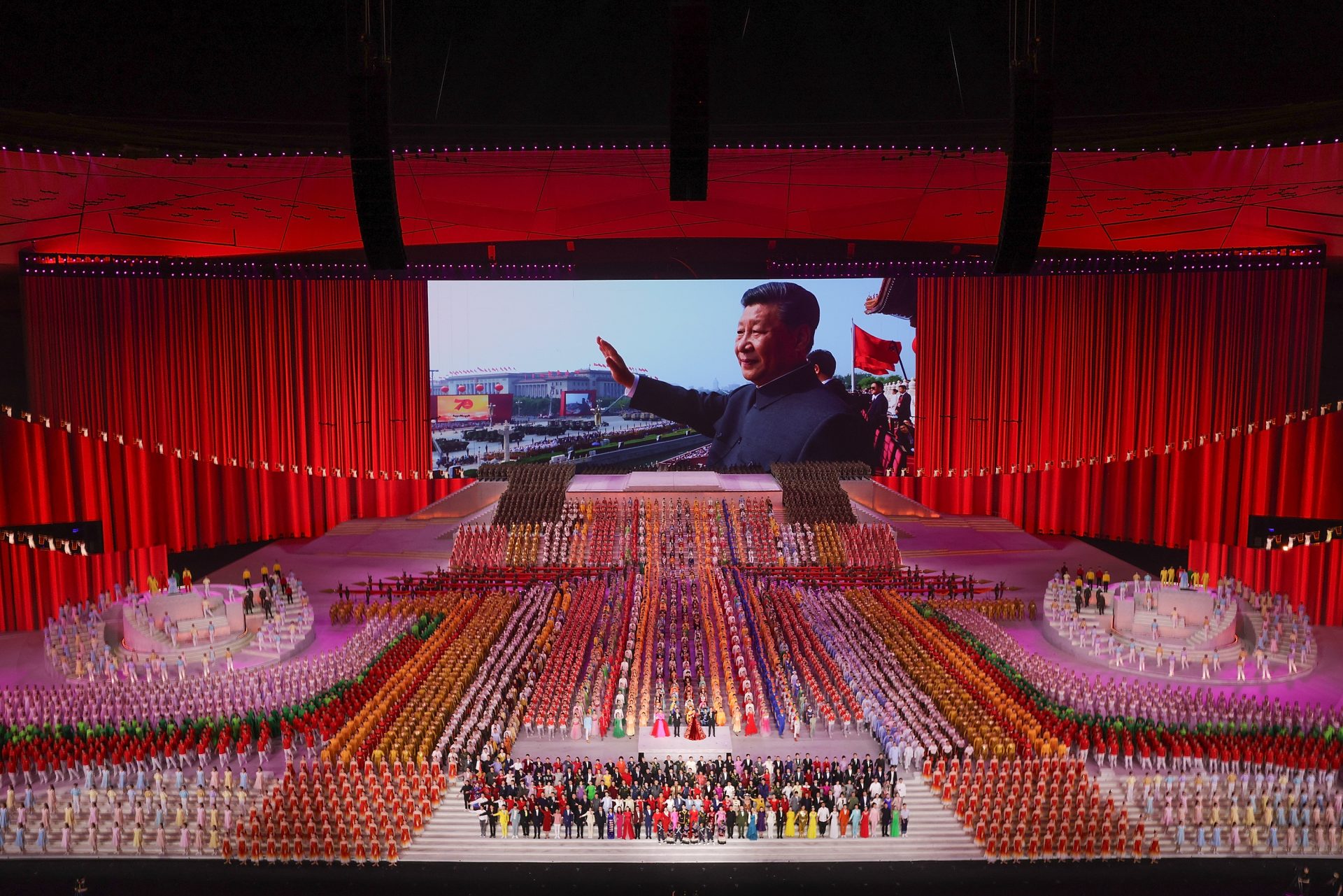 Xi Jinping, in a Maostyle tunic, appears on screen during a performance to mark the 100th anniversary of the Chinese Communist Party, in June 2021. Photo: Lintao Zhang/ Getty Images