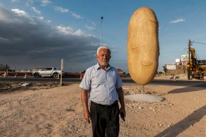 George Tasou is proud of helping to bring a giant potato statue to the Cypriot village of Xylofagou. Photo: Iakovos Hatzistavrou/AFP via Getty Images