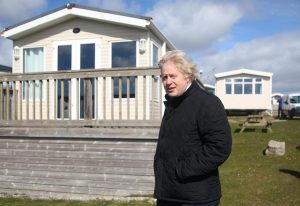 Boris Johnson visits a caravan park in Cornwall, before going somewhere far more glamorous on his own holiday. Photo: Tom Nicholson/Pool/AFP via Getty Images.