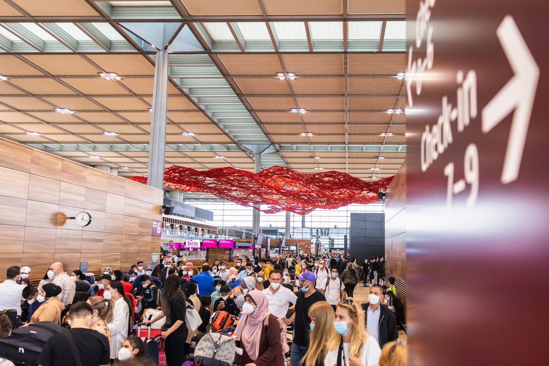 Passengers wait to check in at Berlin’s ill-fated BER airport. Photo: Maja Hitij/Getty Images.