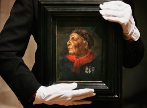 Writer and historian Helen Rappaport, holds a portrait of Mary Seacole by  Albert Challen dated 1869, in the National Portrait Gallery. (Photo by Bruno Vincent/Getty Images)