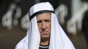 A Newcastle United supporter poses in a home-made head dress outside the club’s stadium after its sale to a Saudi-led consortium. Photo: Oli Scarff/AFP via Getty Images