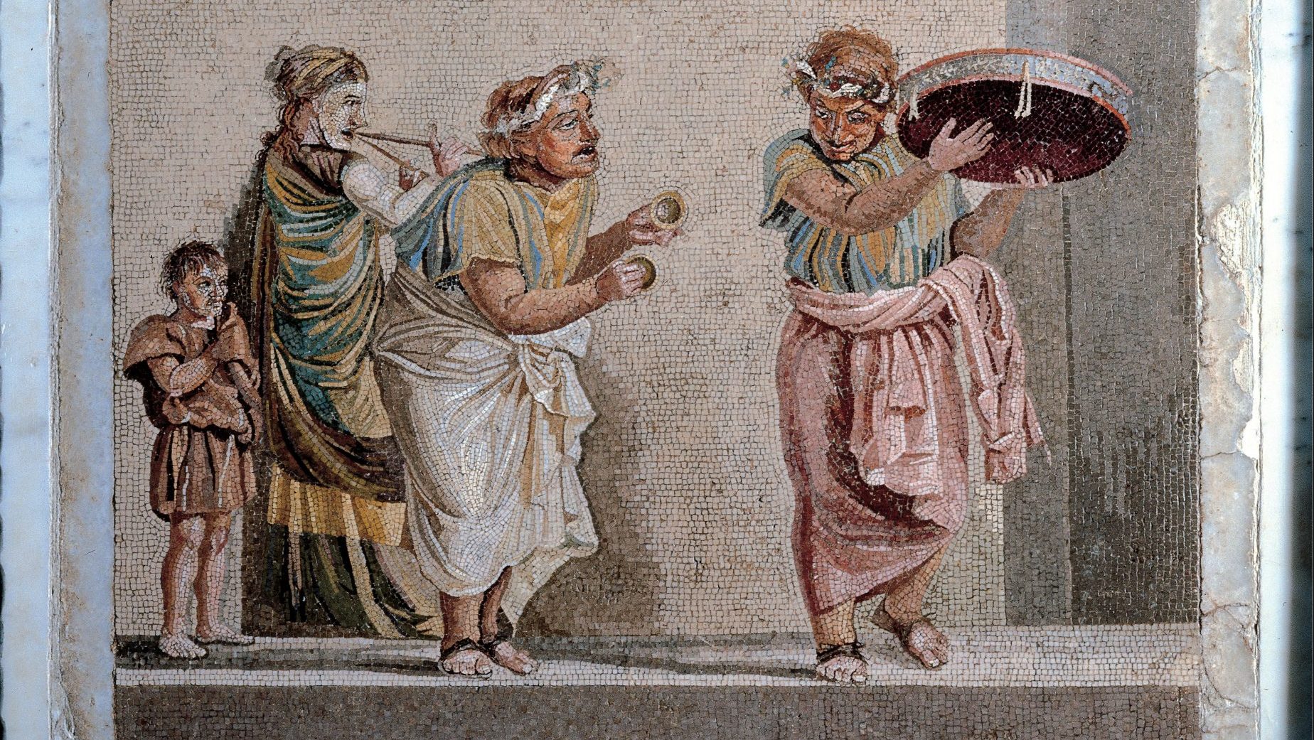 Street musicians from Ancient Rome depicted in a floor mosaic at the Naples National Archaeological Museum. Photo: Mondadori Portfolio/
Getty Images.