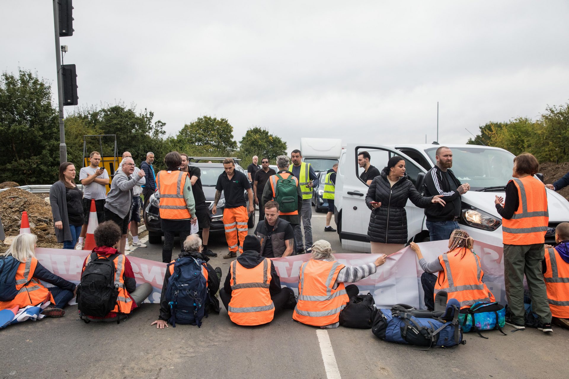 Angry motorists confront Insulate Britain protestors blocking a slip road at Junction 25 of the M25, near Enfield. Photo: Mark Kerrison/In Pictures via Getty Images.