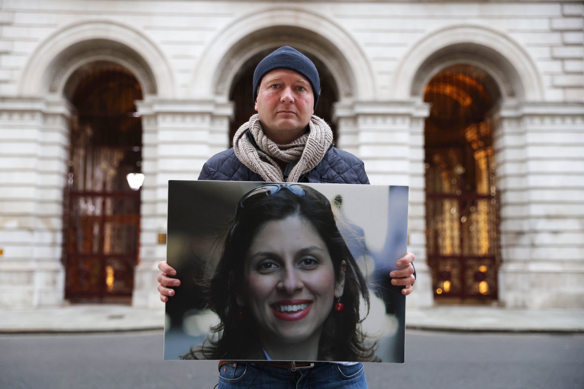 Richard Ratcliffe holds up a photo of his wife as he protests outside the Foreign Office while on hunger strike. Photo: Hollie Adams/Getty Images