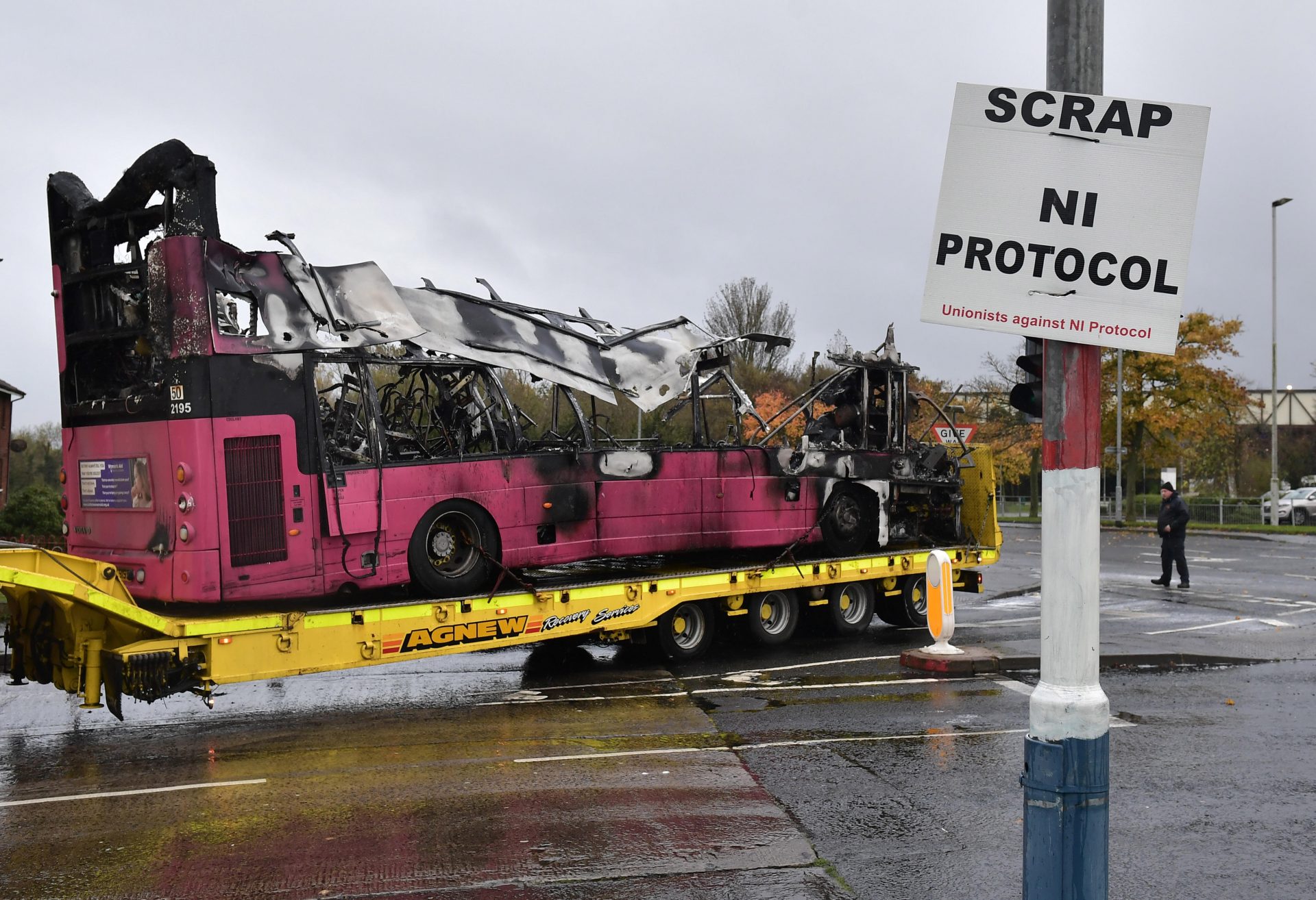 A bus hijacked and burnt by loyalists protesting against the Northern Ireland Protocol is removed from an estate (Photo by Charles McQuillan/Getty Images)