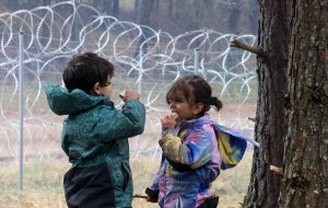 Children at a migrants’ camp on the Belarusian-Polish border. Photo: Leonid Shcheglov/TASS via Getty Images.