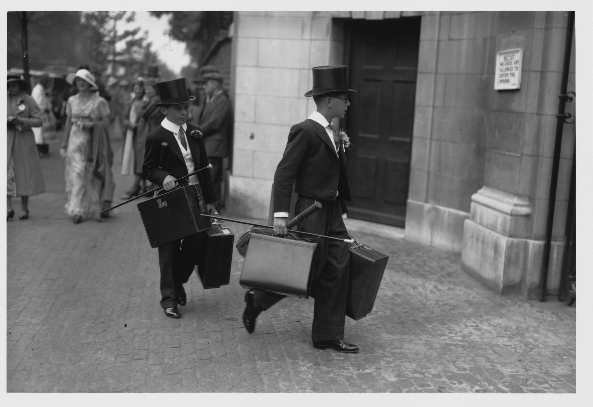 Portfolios aplenty... two students dressed in uniform, carrying briefcases arrive at Lords in 1934. Photo: Corbis via Getty Images