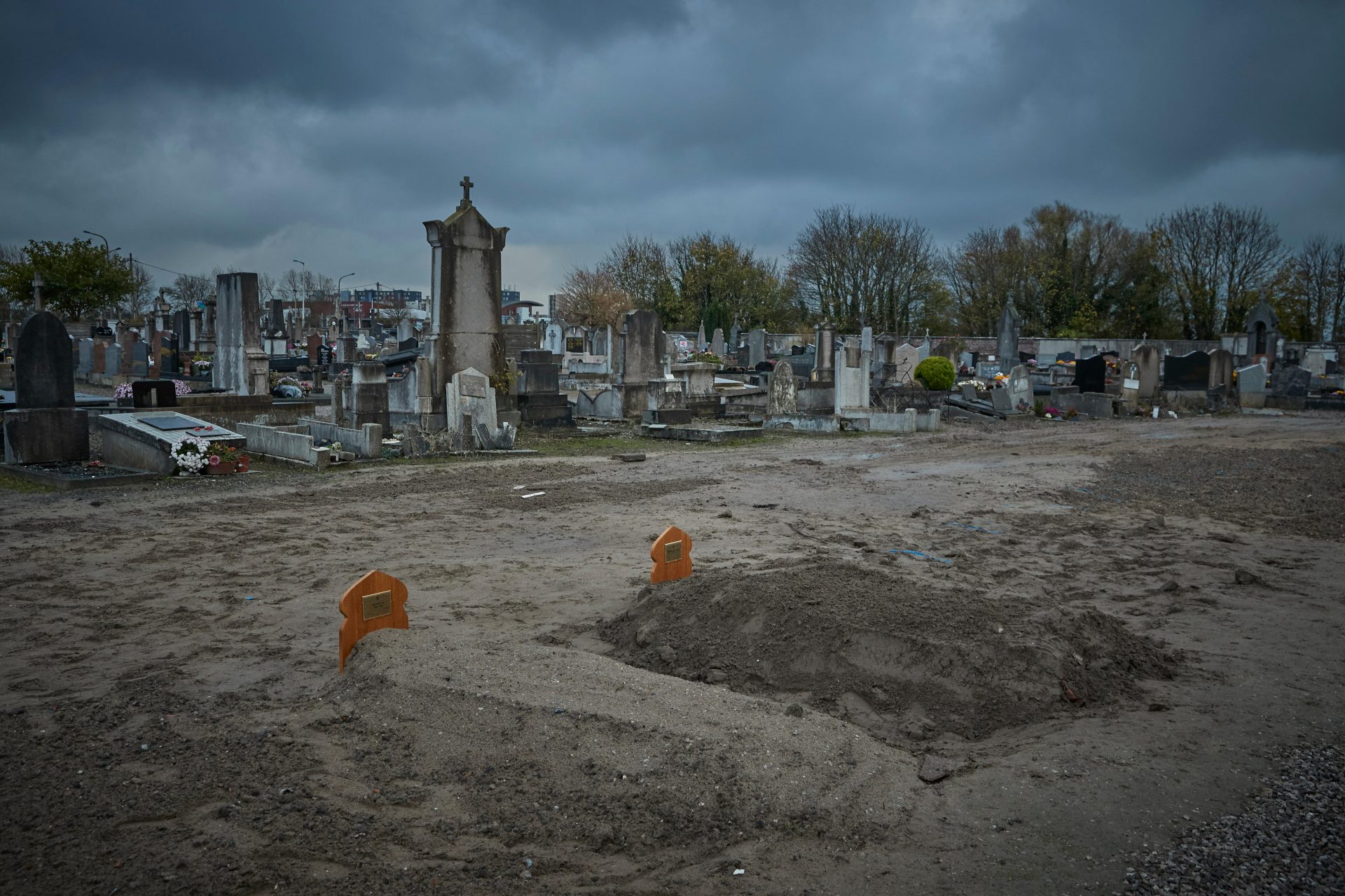 The graves of Ali Ismail Ali Ahmed, left, and Ibrahim Hamat Abdallah, who died crossing the Channel, lie in a section of the Calais graveyard reserved for migrants. Photo: by Kiran Ridley/Getty Images