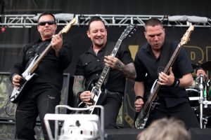 Hank Shermann,
Michael Poulsen, Anders Kjølholm and, in background, Jon Larsen of Danish band Volbeat. Photo: Joey Foley/Getty Images.