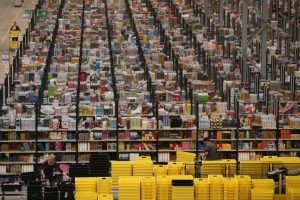 Employees select and dispatch items in the huge Amazon ‘fulfilment centre’ warehouse in Peterborough. Photo: Oli Scarff/ Getty Images
