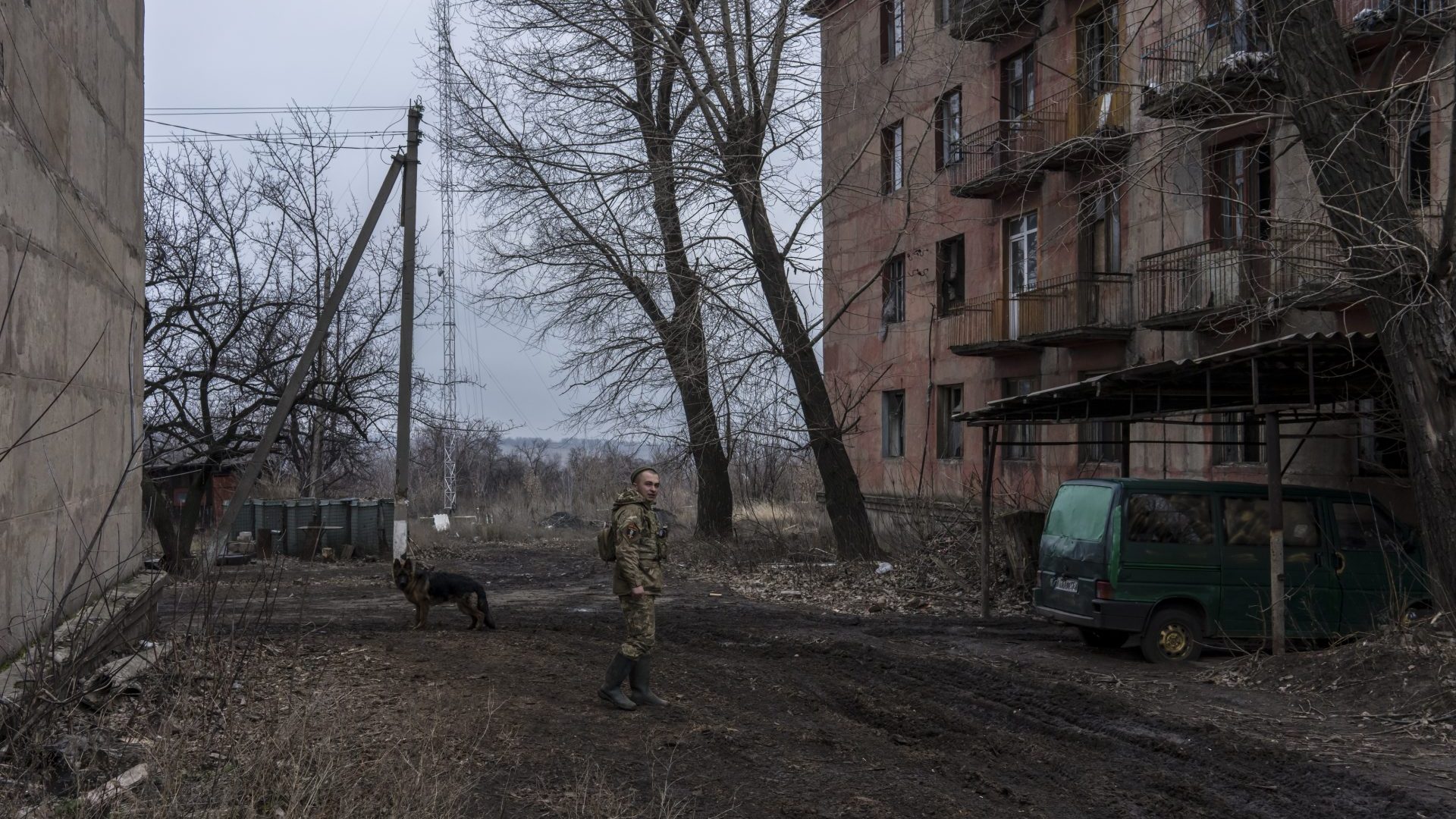 A Ukrainian soldier stands outside his brigade’s barracks
on the front line in Zolote. Photo: Brendan
Hoffman/Getty 
