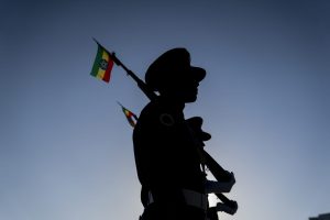 Republican March Band of Ethiopia stand on guard as a ceremony is held to support the Ethiopian military troops. Photo:
 Getty Images / Stringer.