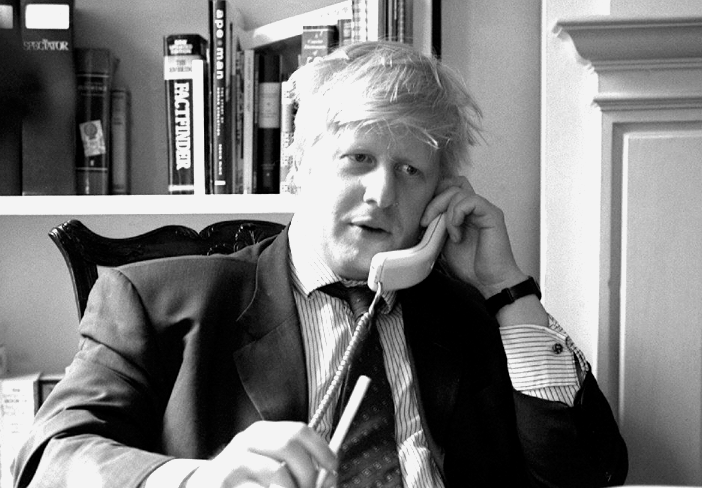 Boris Johnson the journalist at his desk.