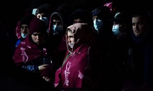 A group of people thought to be migrants after being brought in to Dover. Photo; Gareth Fuller/PA Wire/PA Images.