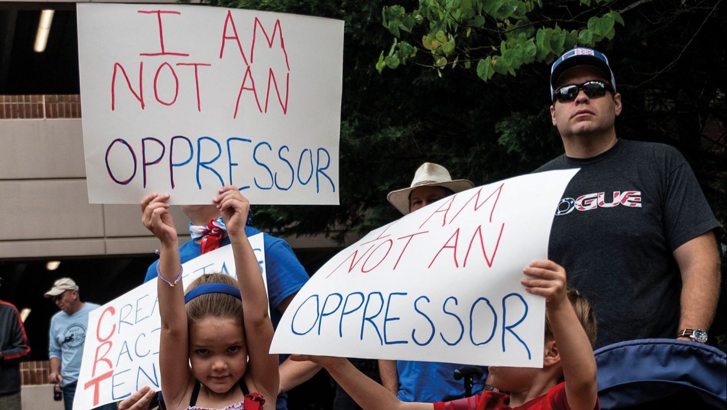 Children in Virginia protest against Critical Race Theory claiming it teaches white people to see themselves oppressors of Black Americans. Photo: ANDREW CABALLERO-REYNOLDS/ AFP via Getty Images.
