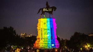 A statue of Confederate general 
Robert E Lee gets a makeover in 
Richmond, Virginia. Photo: Eze Amos/Getty.