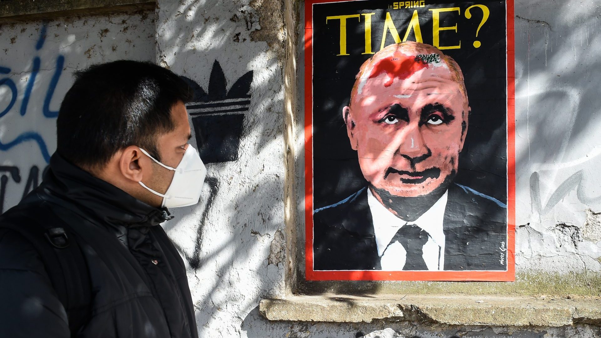 A mural in Rome by street artist Harry Greb depicts a hypothetical Time magazine cover featuring Vladimir Putin with a birthmark in the shape of Ukraine. Photo: Marilla Sicilia/ Mondadori Portfolio/Getty