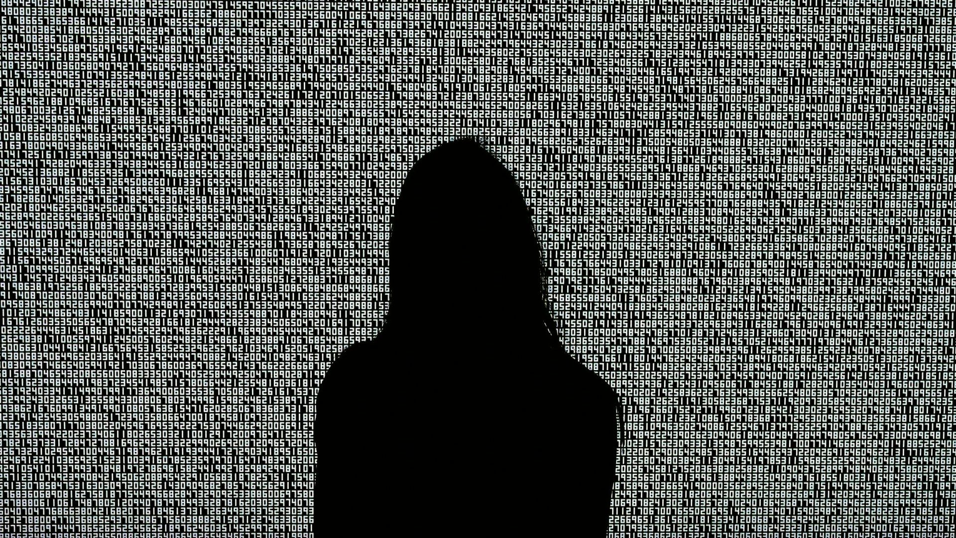 A woman looks at an NFT by Ryoji Ikeda titled A Single Number That has 10,000,086 Digits. Photo: Timothy A Clary/AFP/Getty
