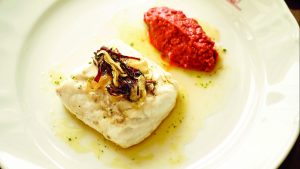 Hake cooked Basque-style, with garlic and Romesco sauce