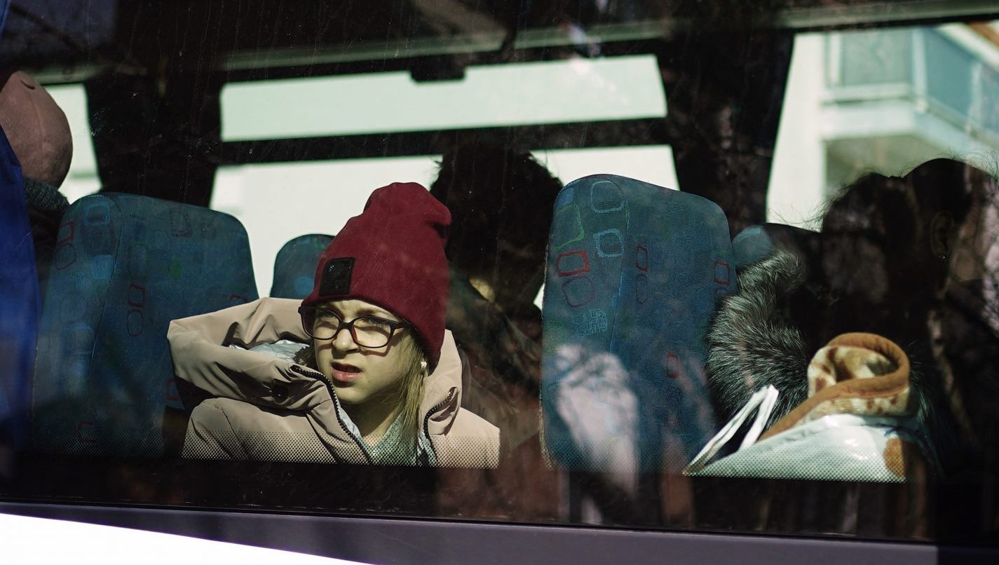 Ukrainian refugees sit on board a bus before it departs from the Centre Europeen de Sejours youth hostel in Calais. Photo: Aaron Chown/PA Wire/PA Images