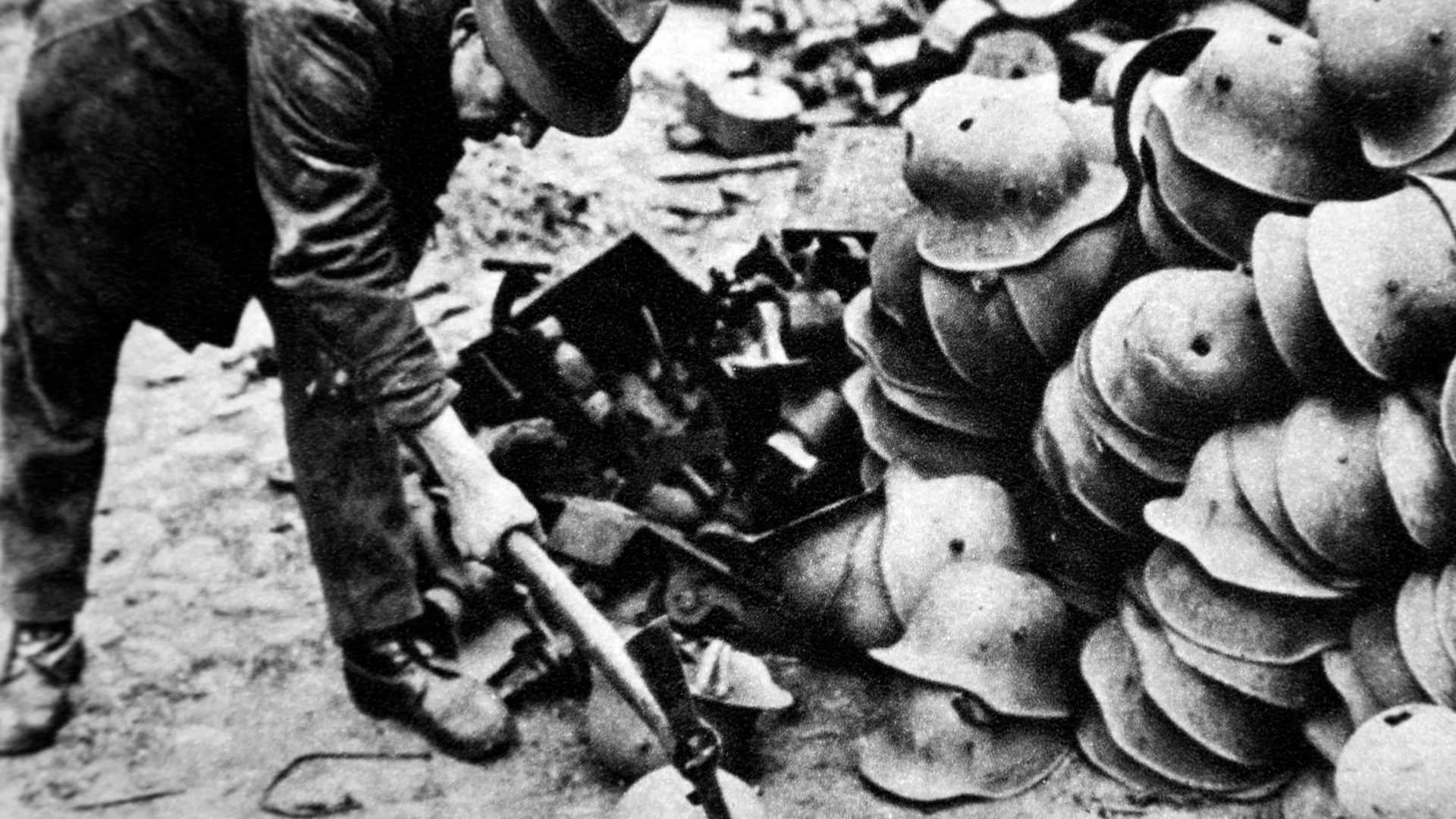 German infantry helmets are destroyed in 1919 under the terms of the Treaty of Versailles. This week 
Germany woke up to its 
military responsibility in defending Europe. Photo: Historica Graphica