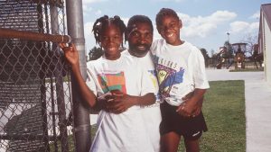 Venus and Serena Williams with their
father, Richard, in Los Angeles, 1991. Photo: Paul Harris/Getty