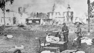 Nazi soldiers in a burning Russian village on the 
outskirts of Leningrad, 1941. Photo: Bettmann