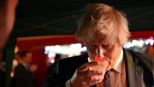 Prime minister Boris Johnson samples an Isle of Harris Gin as he visits a UK Food and Drinks market. Photo: Justin Tallis/PA Wire/PA Images