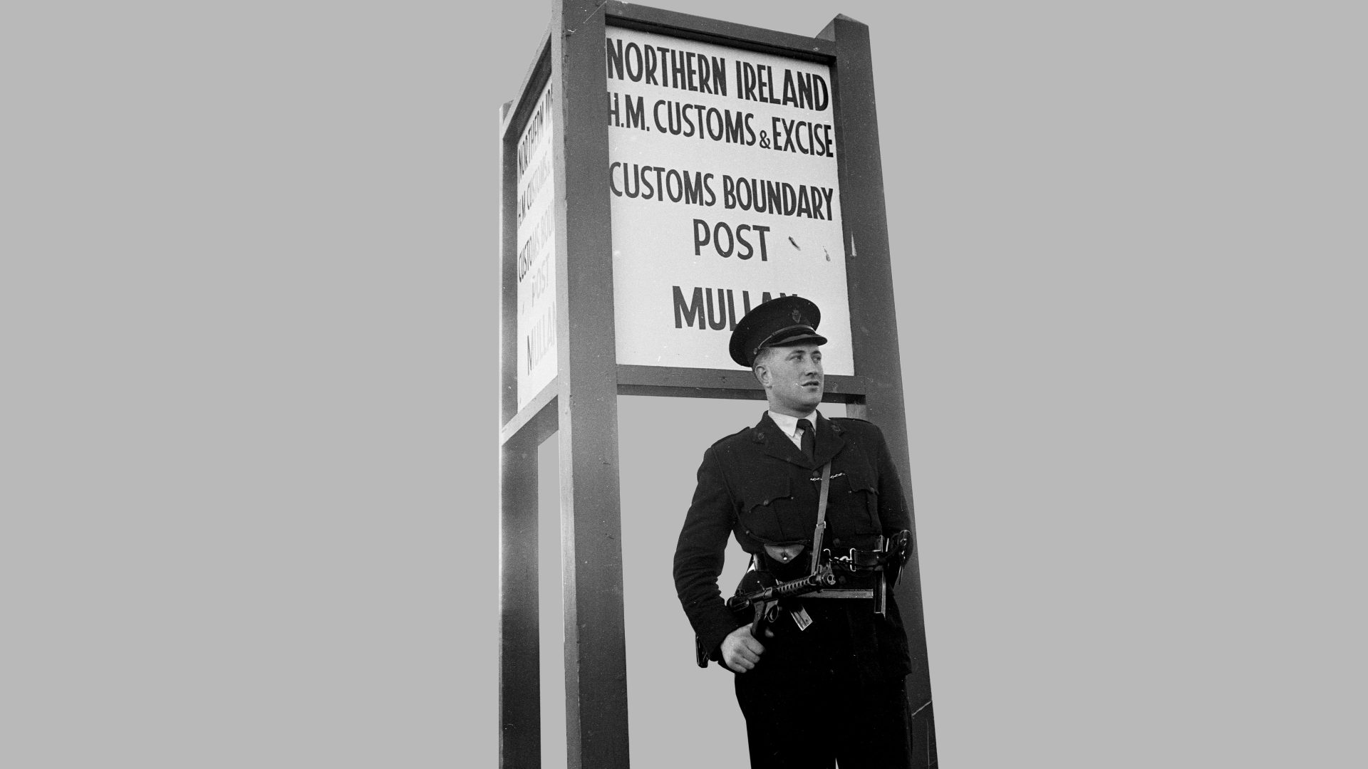 September 1961: A member of the Royal Ulster Constabulary (RUC) stands guard at a customs boundary post in Northern Ireland. Photo: Keystone Features/Getty Images