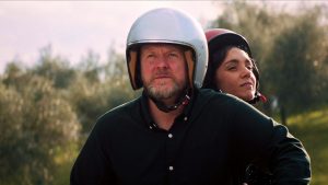Anders Matthesen as 
chef Theo takes Cristiana Dell’Anna as Sofia for a ride in Toscana