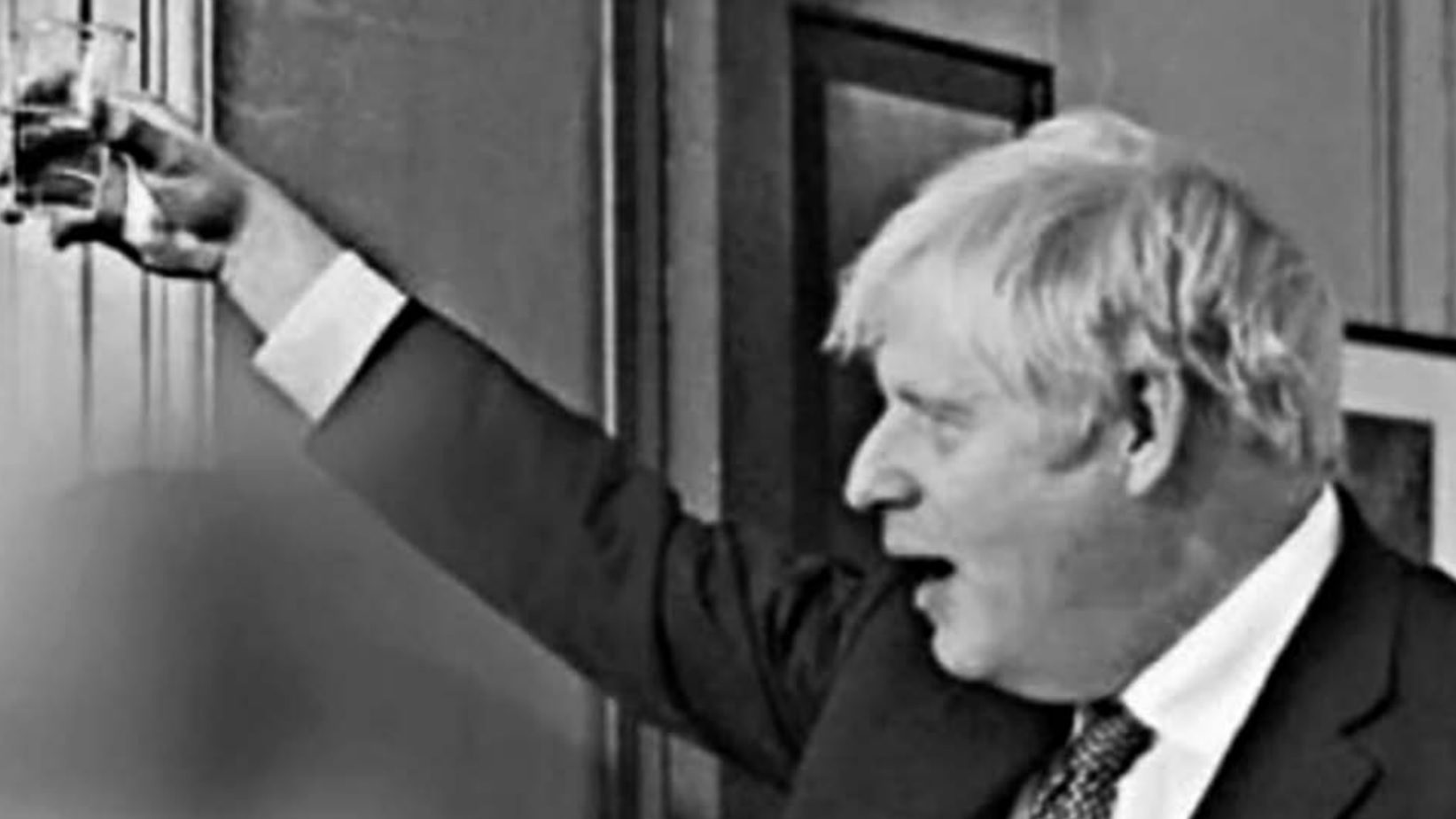 A photo of the No 10 leaving party in November 2020, obtained by ITV news, shows Boris Johnson raising his glass for a toast by a table with wine and gin bottles (Photo: ITV News)