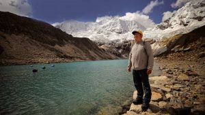 Saúl Luciano Lliuya stands before Palcacocha Lake in Huaraz, Peru. Photo: Luka Gonzales