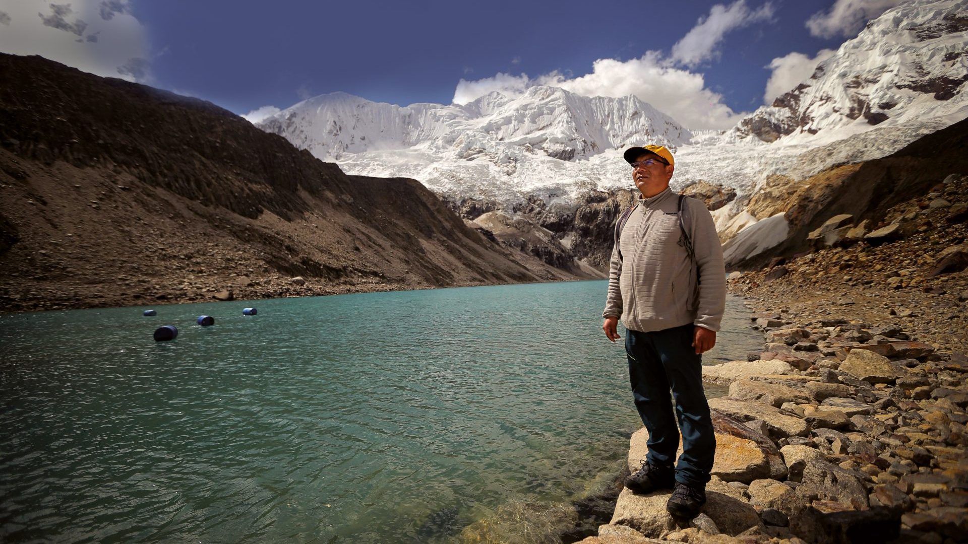 Saúl Luciano Lliuya stands before Palcacocha Lake in Huaraz, Peru. Photo: Luka Gonzales