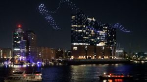 Glowing drones fly in 
formation around the 
Elbphilharmonie concert hall in Hamburg during a 
performance of the light installation Breaking Waves
by Drift. Photo: Axel Heimken/AFP