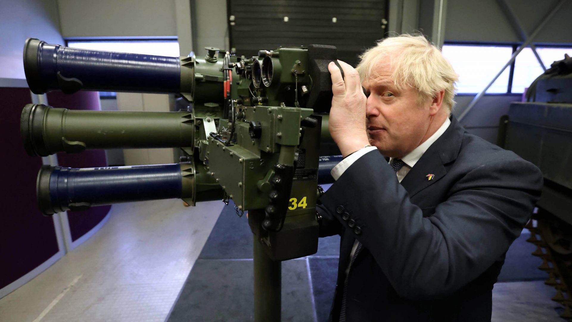Down the barrel of a gun: Boris Johnson poses with shoulder-launch missile system during a visit to Northern Ireland. Photo: Liam McBurney/Getty