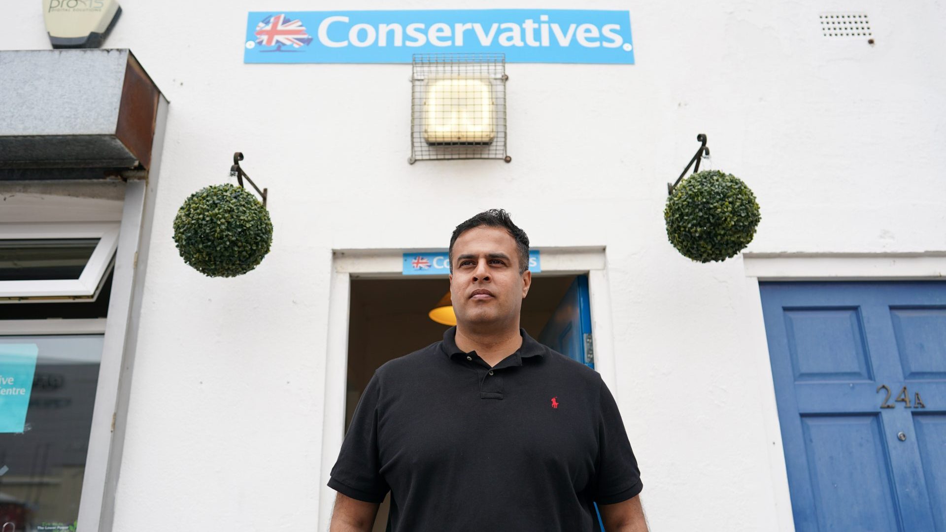 Conservative Party candidate, Nadeem Ahmed poses for pictures near the Conservative Party office in Wakefield ahead of the By-election on June 18 (Photo by Ian Forsyth/Getty Images)