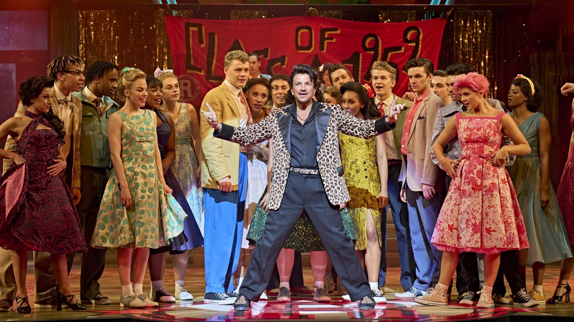 Peter Andre as Vince Fontaine (centre) in Grease (Photo: Manuel Harlan)