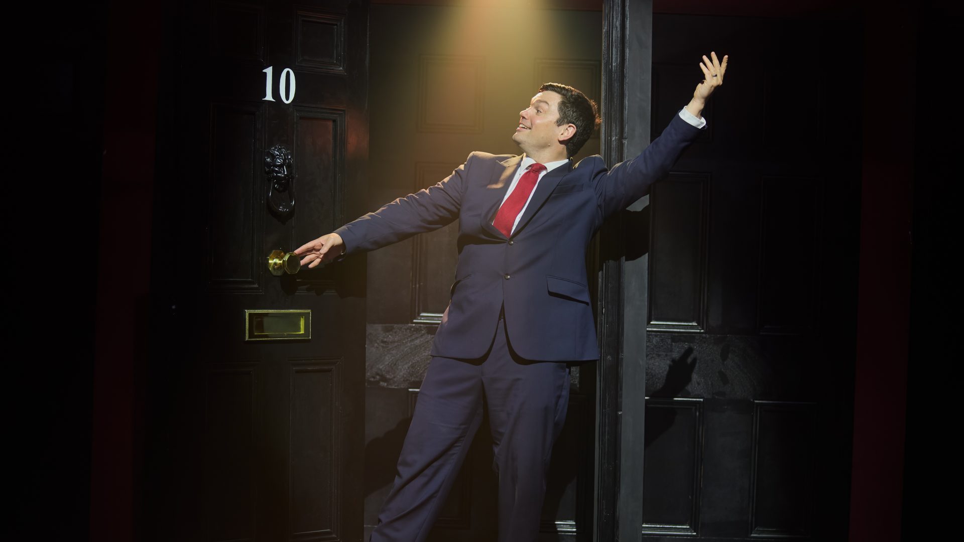 Charlie Baker as former PM Tony Blair in Harry Hill and Steve Brown’s satirical musical. Photo: Mark Douet