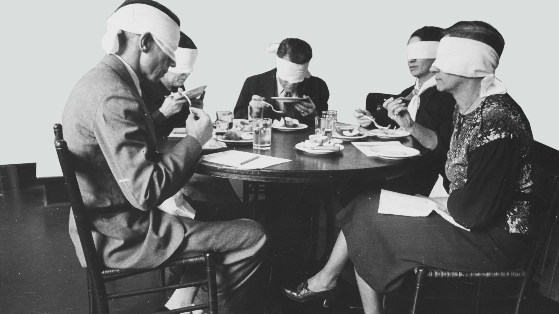 A blindfolded focus group taste-testing meats. Photo: Smith Collection/ Gado/Getty Images