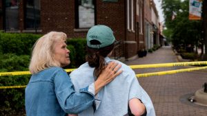 Residents visit a makeshift memorial for victims of the 
July 4 mass shooting in 
Highland Park, Illinois. Photo: Max Herman/AFP/
Getty Images