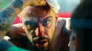 A Verdi team player receives medical 
assistance during the Calcio Storico in 2021. Photo: Vincenzo Pinto/AFP