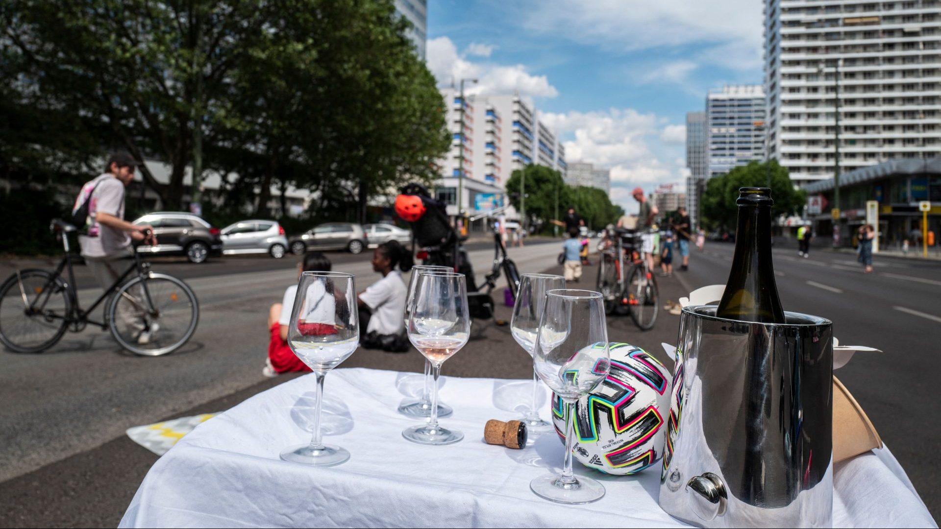 A table is set in the middle of a deserted Leipziger Strasse, one of Berlin's busiest avenues, during a protest last year (Photo by JOHN MACDOUGALL/AFP via Getty Images)