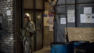 A Russian serviceman 
stands guard at a tractor parts factory in Melitopol in Zaporizhzhia, Ukraine. Photo: Olga Maltseva/AFP
