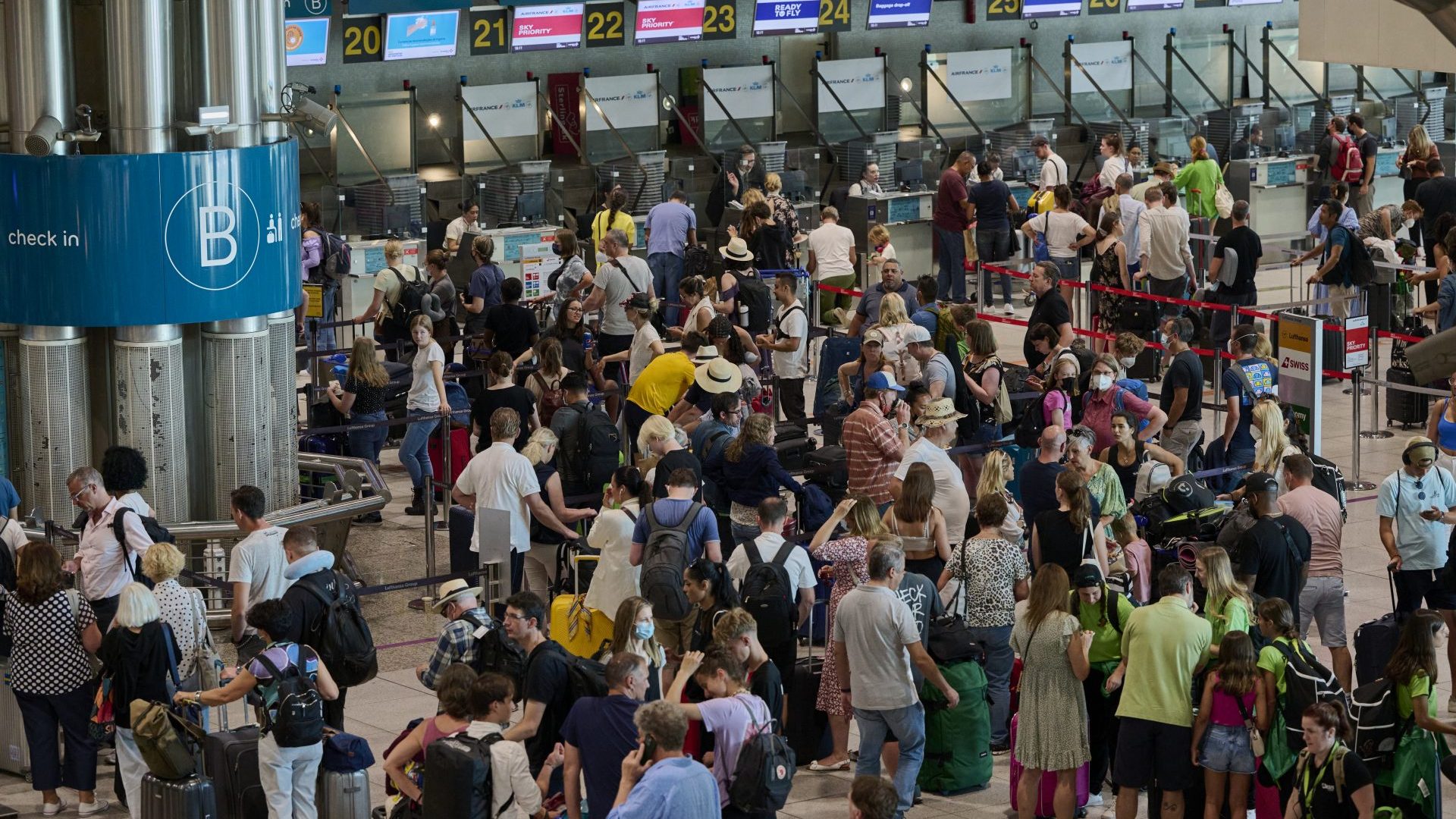 Travelers crowd Terminal 1 departures hall while queueing at Humberto Delgado International Airport in Lisbon (Photo by Horacio Villalobos/Corbis via Getty Images)