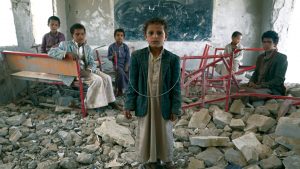 Pupils stand in the ruins of their former 
classroom in Saada City, Yemen; the 
school was destroyed in June 2015 
by Saudi Arabia’s air campaign, which 
is supported by British arms sales, 
engineers and analysts. Photo: Giles Clarke/UN OCHA/Getty