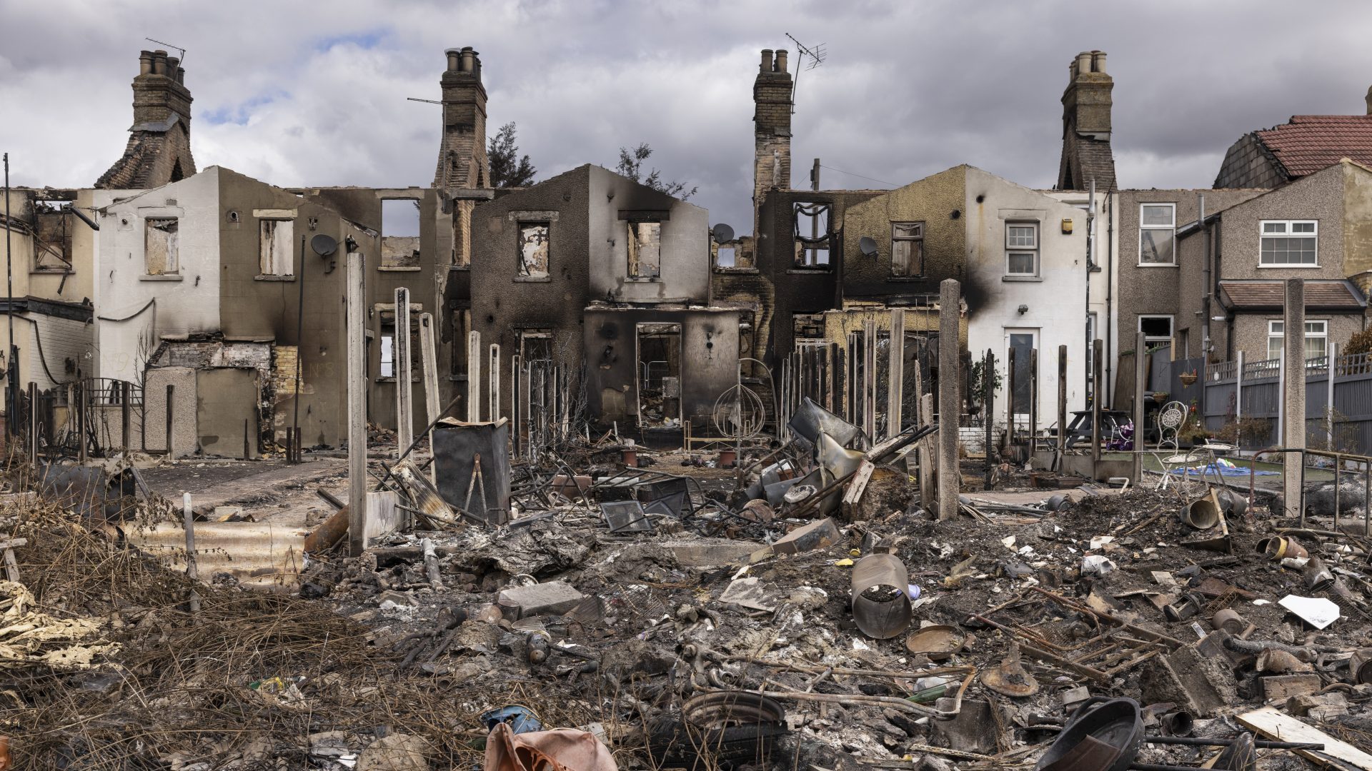 Homes gutted by fire on July 25, 2022 in Wennington, Greater 
London, on the day the UK 
recorded its highest ever temperatures. Photo: Dan Kitwood/Getty