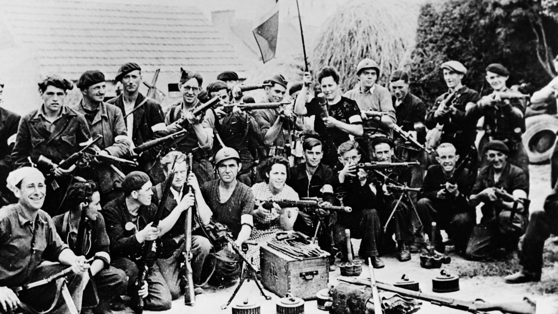 A group of French Resistance fighters 
in the courtyard of a farm, summer 1944. Photo: AFP/Getty Images