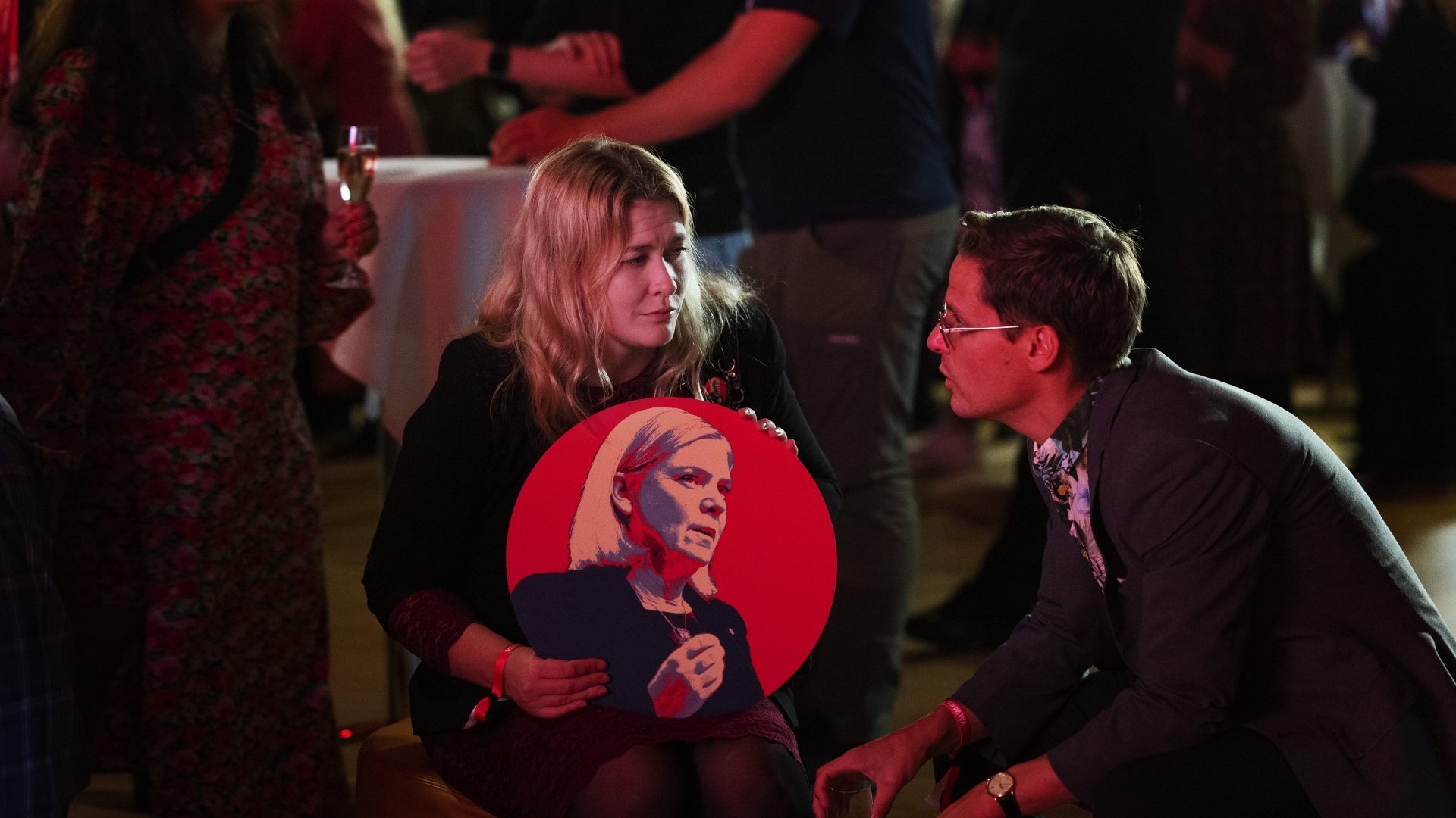 A tearful Social Democratic Party supporter holds a banner of defeated PM Magdalena Andersson on election night in Stockholm. Photo: Nils Petter Nilsson/Getty